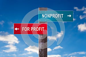 Nonprofit versus For Profit - Road sign with two options.