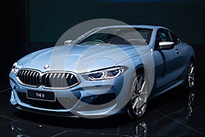 Nonthaburi , Thailand - Dec 6, 2018: BMW the 8 Series Coupe blue color in motor expo , black background