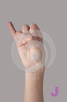 Nonverbal alphabet. Letter J on grey background