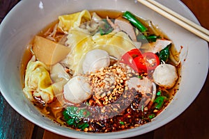 Noodle and dumpling with barbecued red pork.