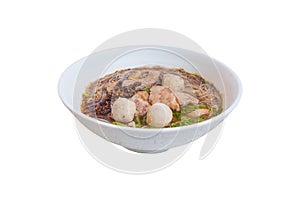 Noodle meat ball and pig piece in bowl on table with broth intense. top view isolated over white background and clipping path