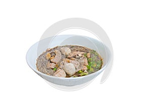 Noodle meat ball and pig piece in bowl on table with broth intense. top view isolated over white background and clipping path