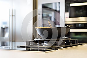 Noodle wok on gas stove on workplate
