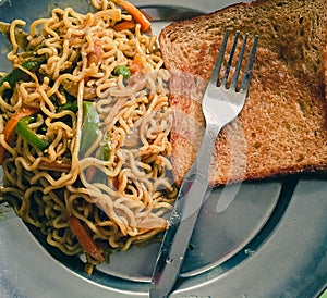 Noodles with bread and a fork