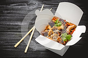 Noodles with chicken, carrots, mushrooms and sweet peppers