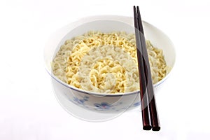 Bowl of noodles and chopsticks