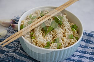 Noodles with green onions on backgroun cook dinner