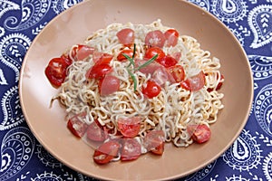 Noodles with a sauce of tomatoes