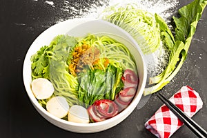 Noodles in Thailand Ba-Mee-Moo-Dang or pasta of Asia and dried noodles with ingredient on black table.Close up and top view.