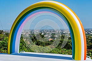 Noon aerial view of the Yilan Plain with Guishan Island and a rainbow archway