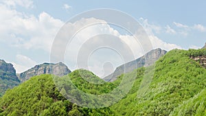 At noon the mountains and clouds