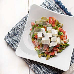 Nopal cactus salad with cheese on white background. Mexican food