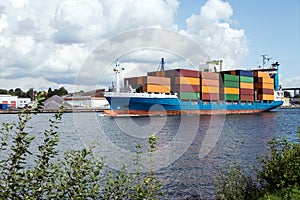 Nord-Ostsee-Kanal with container ship in Rendsburg, Schleswig-Holsein