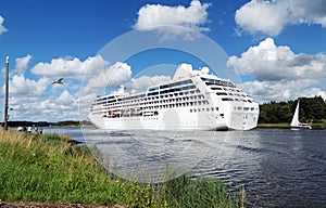 Nord-Ostsee-Kanal with white cruise ship in Rendsburg, Germany