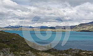 Nordenskjold lake view, with snowy mountais in the back.