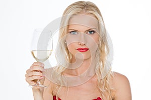Nordic dressed red girl keeping a glass of wine