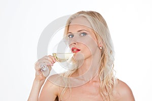 Nordic girl drinking a glass of white wine