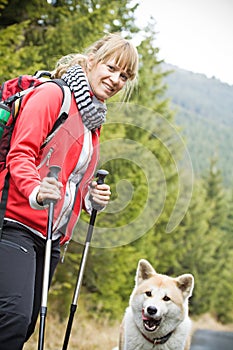 Nordic Walking with dog in mountains