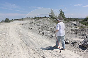 Nordic Walking - elderly woman is hiking in the summer