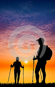 Nordic walking silhouette at sunset