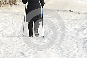 Nordic walking with sticks in winter