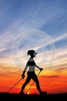 Nordic walking at sunset