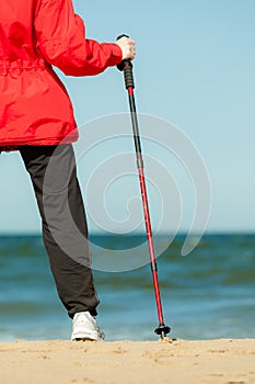 Nordic Walking. Woman Hiking On The Beach.