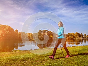 Nordic walking woman outdoors