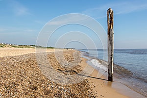 Norfolk coastline. Coastal landscape image of sea and beach at Caister East Anglia UK photo