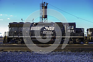 Norfolk Southern GP40-2 diesel locomotive 3035 sits next to a sanding tower