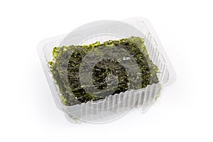 Nori seaweed snack in open food container on white background