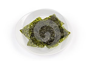 Nori seaweed snack on white dish on white background