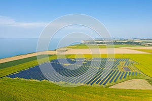Norman solar panels in the middle of the flax fields towards Veules les Roses in Europe, France, Normandy, in summer, on a sunny