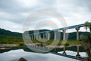 The Norman Wood Bridge Over the Susquehanna River Reflecting In a Small Body of Water