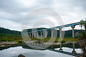 The Norman Wood Bridge Over the Susquehanna River Reflecting In a Small Body of Water
