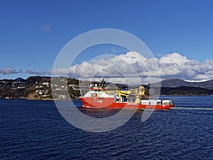 The Normand Ocean Offshore Supply Vessel in Bergen Fjord, heading out fully loaded with Oil and Gas Equipment