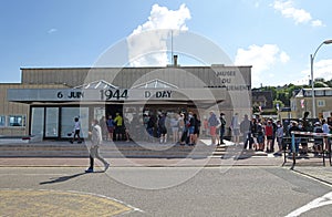 Queues outside the Musee De Debarquement which is a museum commemorating WWII`s Normandy campaign &