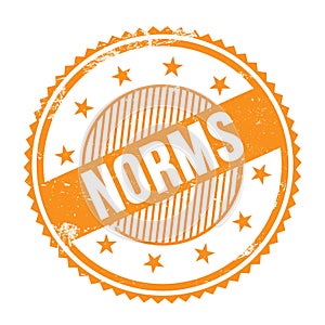 NORMS text written on orange grungy round stamp