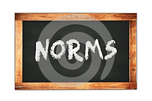 NORMS text written on wooden frame school blackboard