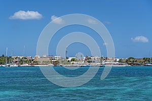 Norten beach on colorful Isla Mujeres island near Cancun in Mexico, view from the ferry photo