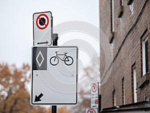 North American standard roadsign indicating a bike lane in Montreal, Quebec, Canada.