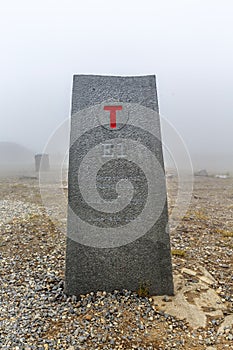 North Cape Nordkapp, on the northern coast of the island of Mageroya in Finnmark, Northern Norway on heavy foggy day .