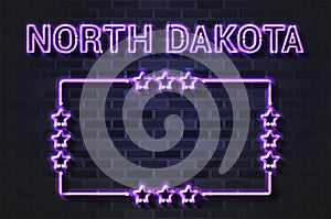 North Dakota US State glowing violet neon letters and starred frame on a black brick wall