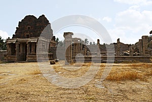 North Gopura of the inner courtyard and ruins of a mandapa on the right side, Achyuta Raya temple, Hampi, Karnataka. Sacred Center
