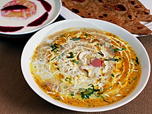 North Indian cuisine Malai Kofta curry, pineapple raitha, plain paratha