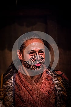NORTH ISLAND, NEW ZEALAND- MAY 17, 2017: Close up of a Maori man with traditionally tatooed face and in traditional