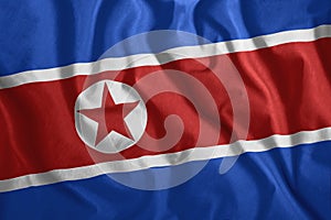 North Korean flag fluttering in the wind. Colorful, national flag of North Korea. Patriotism, a patriotic symbol