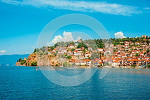 North macedonia. Ohrid. Different buildings and houses with red roofs on hill. View from lake