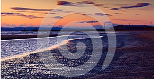 North sea beach of Ayr at sunset photo