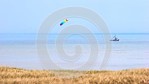 North Sea Coast With Crabber Boat And Wind Kite